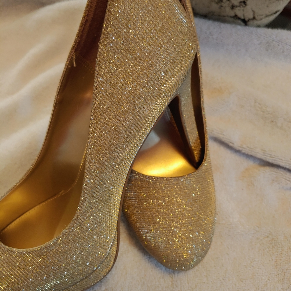 Gold high heel shoes